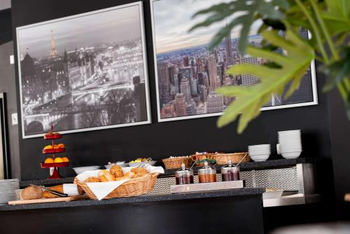 a breakfast buffet with bread and a view of a city at Days Inn Dessau in Dessau