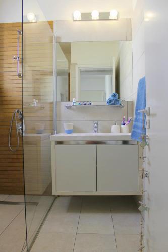 a bathroom with a sink and a shower at Villa St. Nicolas 8 - Protaras in Protaras