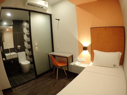 Ένα ή περισσότερα κρεβάτια σε δωμάτιο στο Apex Boutique Hotel @ Bandar Sunway