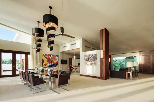 a living room with a dining table and chairs at Under the Stars Luxury Apartment in Boracay