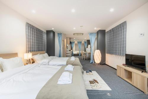 Postel nebo postele na pokoji v ubytování Uhome Ueno Apartment 4
