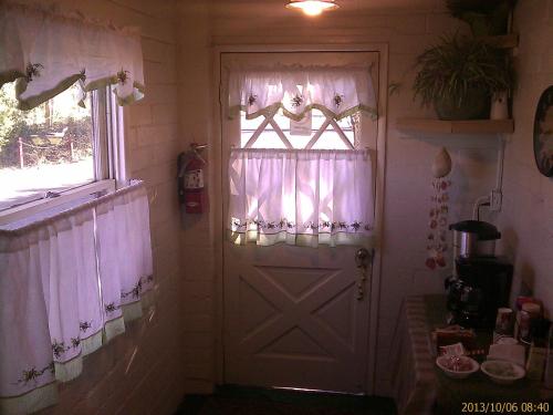 a room with a white door and a window at Ranch Motel in Tehachapi