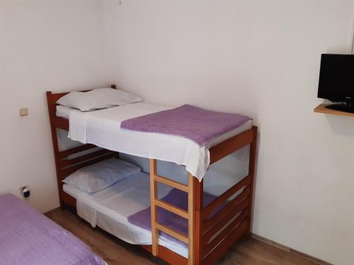Postel nebo postele na pokoji v ubytování Apartmani Šime - 1