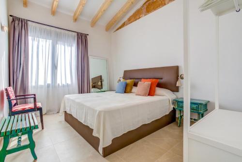 Postel nebo postele na pokoji v ubytování Ca la Tia Joanaina by Sealand Villas