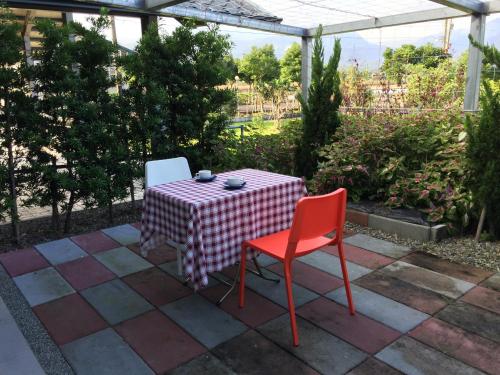 a table and two chairs sitting on a patio at Sunny House II in Guilin