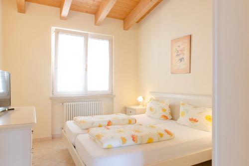 Postel nebo postele na pokoji v ubytování Residence Terry