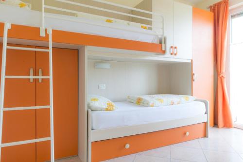 Postel nebo postele na pokoji v ubytování Residence Terry