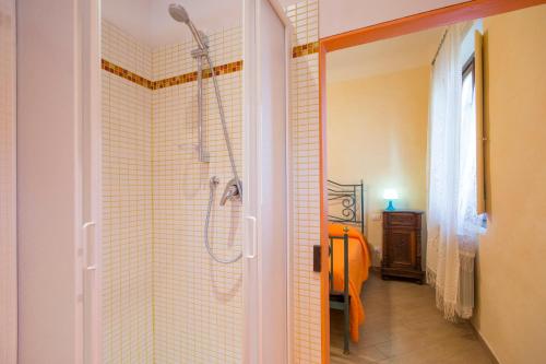 a bathroom with a shower with a shower head at Dimora Ricceri in Impruneta