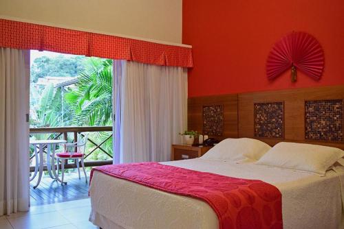 A bed or beds in a room at Bella Ilha Pousada