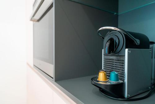 a toaster sitting on a counter next to a wall at Vienna Residence, Hietzing - Schönbrunn in Vienna