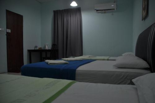 Postel nebo postele na pokoji v ubytování Sukau tomanggong view bed & breakfast