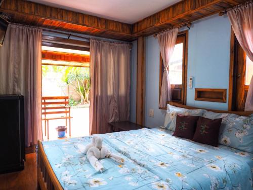 Posteľ alebo postele v izbe v ubytovaní Baansuan Resort