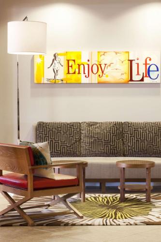 a living room with a couch and a chair at Hyatt Regency Newport Beach in Newport Beach