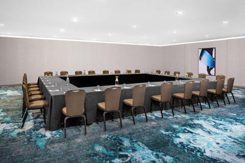 a conference room with a long table and chairs at Hyatt Regency Newport Beach in Newport Beach