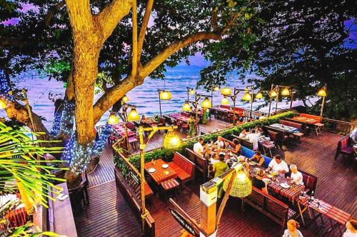 an overhead view of a restaurant with people sitting at tables at Birds and Bees Resort in Pattaya South