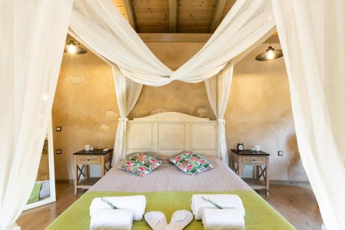 A bed or beds in a room at Vrisali Traditional Stone Villa