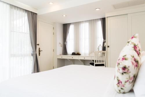 Ένα ή περισσότερα κρεβάτια σε δωμάτιο στο Verano Beach Villa