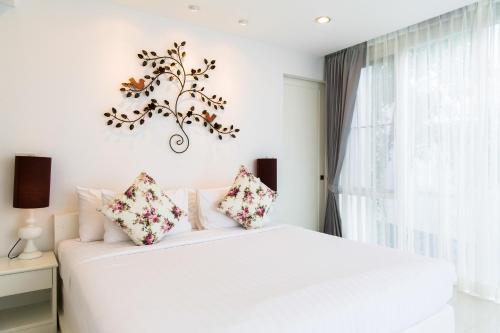 Ένα ή περισσότερα κρεβάτια σε δωμάτιο στο Verano Beach Villa