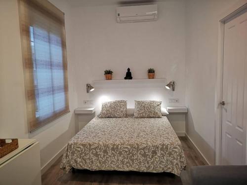 Ліжко або ліжка в номері Apartamento Qurtuba