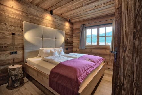 A bed or beds in a room at LISA-Chalets