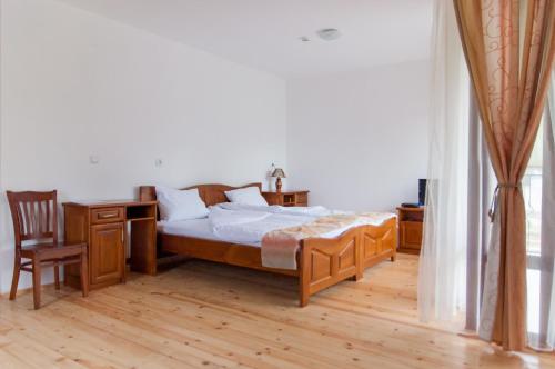Posteľ alebo postele v izbe v ubytovaní Guest House Lŭgŭt