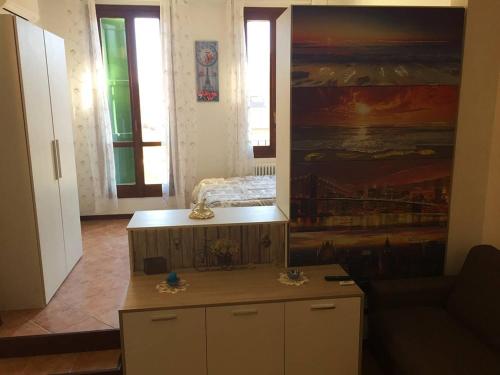 a living room with a couch and a table at Appartamento Guercino in Cento
