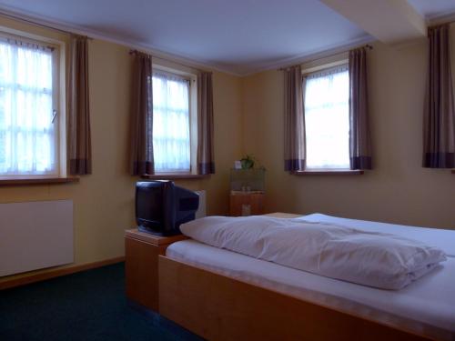 Una cama o camas en una habitación de Hotel Markt3