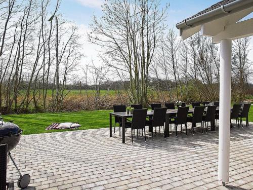 a table and chairs sitting on a patio at 16 person holiday home in Hasselberg in Kappeln