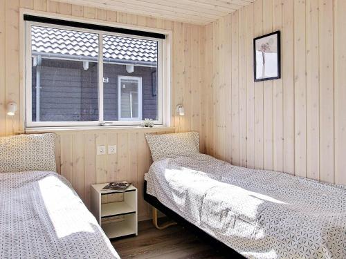Holiday home Kappeln XIV tesisinde bir odada yatak veya yataklar