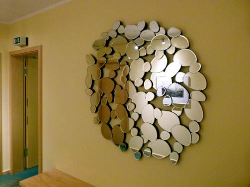 a wall with a heart made out of cups at Hotel Markt3 in Bad Honnef am Rhein