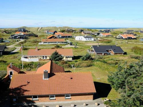 una vista aérea de una casa con techos rojos en 8 person holiday home in Harbo re, en Harboør