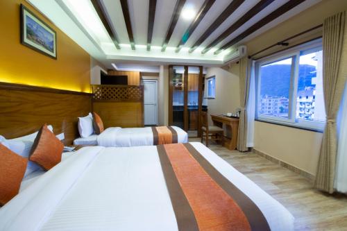 Un pat sau paturi într-o cameră la Hotel Lake Star