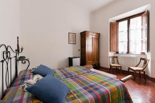 Letto o letti in una camera di Residenza D'Epoca Palazzo Buonaccorsi