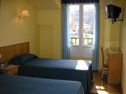 Ein Bett oder Betten in einem Zimmer der Unterkunft Hotel San Juan