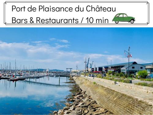 a body of water with a car parked next to a marina at L' Évéa Garden in Le Relecq-Kerhuon