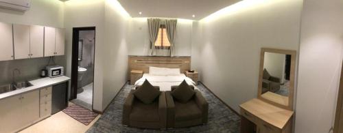 Ένα ή περισσότερα κρεβάτια σε δωμάτιο στο Hala Onaizah