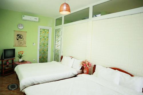 Postel nebo postele na pokoji v ubytování Memory Homestay Hue