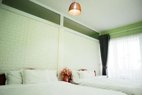 Postel nebo postele na pokoji v ubytování Memory Homestay Hue