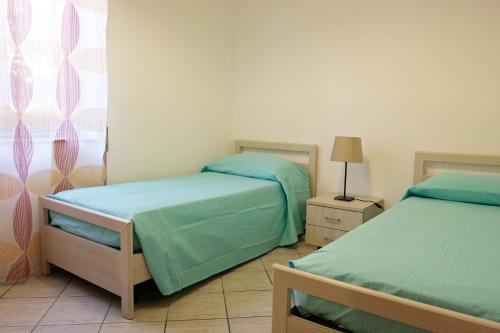 Posteľ alebo postele v izbe v ubytovaní CASA TERRE BAROCCHE