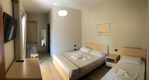 Katil atau katil-katil dalam bilik di Hotel Denta