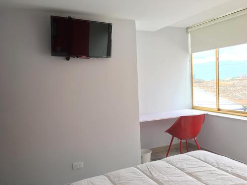 TV a/nebo společenská místnost v ubytování Hotel Garden City Boutique