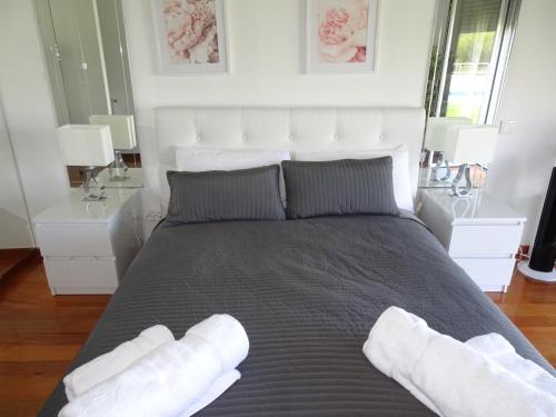 Postel nebo postele na pokoji v ubytování Condomínio jardim das oliveiras