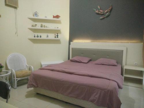 Ένα ή περισσότερα κρεβάτια σε δωμάτιο στο Enny's Guest House