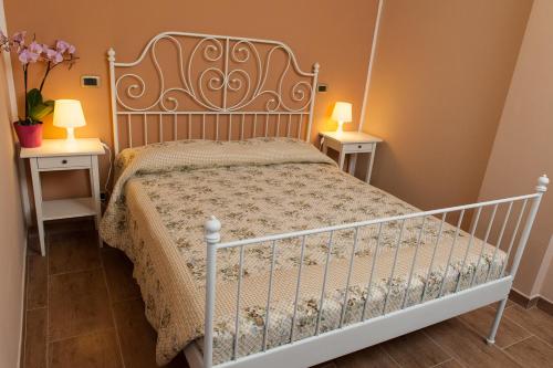 Ένα ή περισσότερα κρεβάτια σε δωμάτιο στο Agriturismo Il Vecchio Pollaio