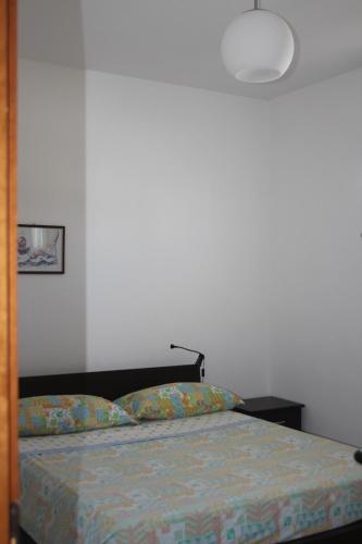Кровать или кровати в номере Casa Carapelle Grazioso villino alto Salento