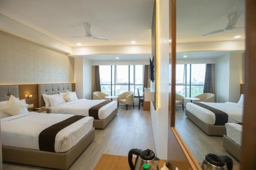 Postel nebo postele na pokoji v ubytování Hotel Grace Galaxy