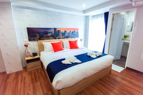 Кровать или кровати в номере 7 Days Premium Hotel at Icon Siam Station