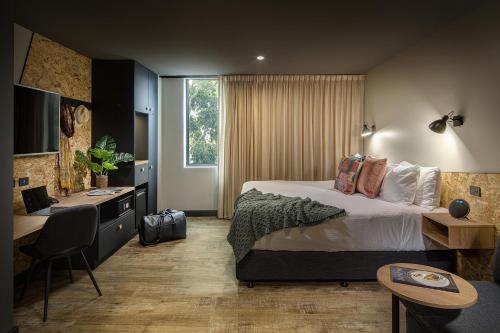 Postel nebo postele na pokoji v ubytování Marion Hotel