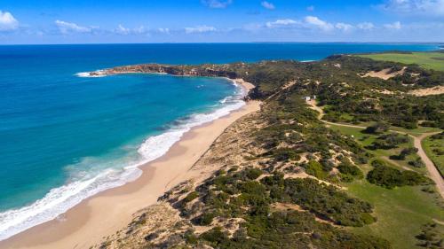 an aerial view of a beach and the ocean at Hillocks Drive in Marion Bay