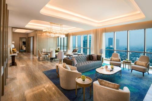 a living room with a couch and chairs and a table at InterContinental Hotels Jakarta Pondok Indah by IHG in Jakarta